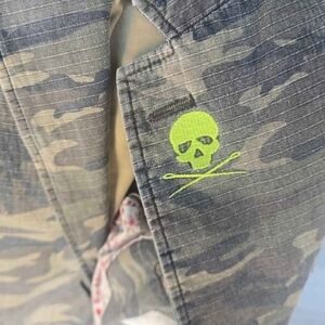 Camouflage Jacket with Neon Skull Design